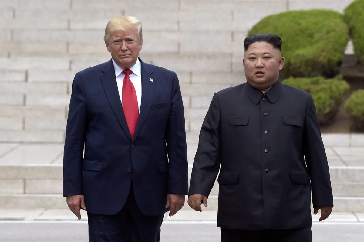 U.S. President Donald Trump meets with North Korean leader Kim Jong Un at the North Korean side of the border in Panmunjom in the Korean Demilitarized Zone, on June 30, 2019. (Susan Walsh/AP)