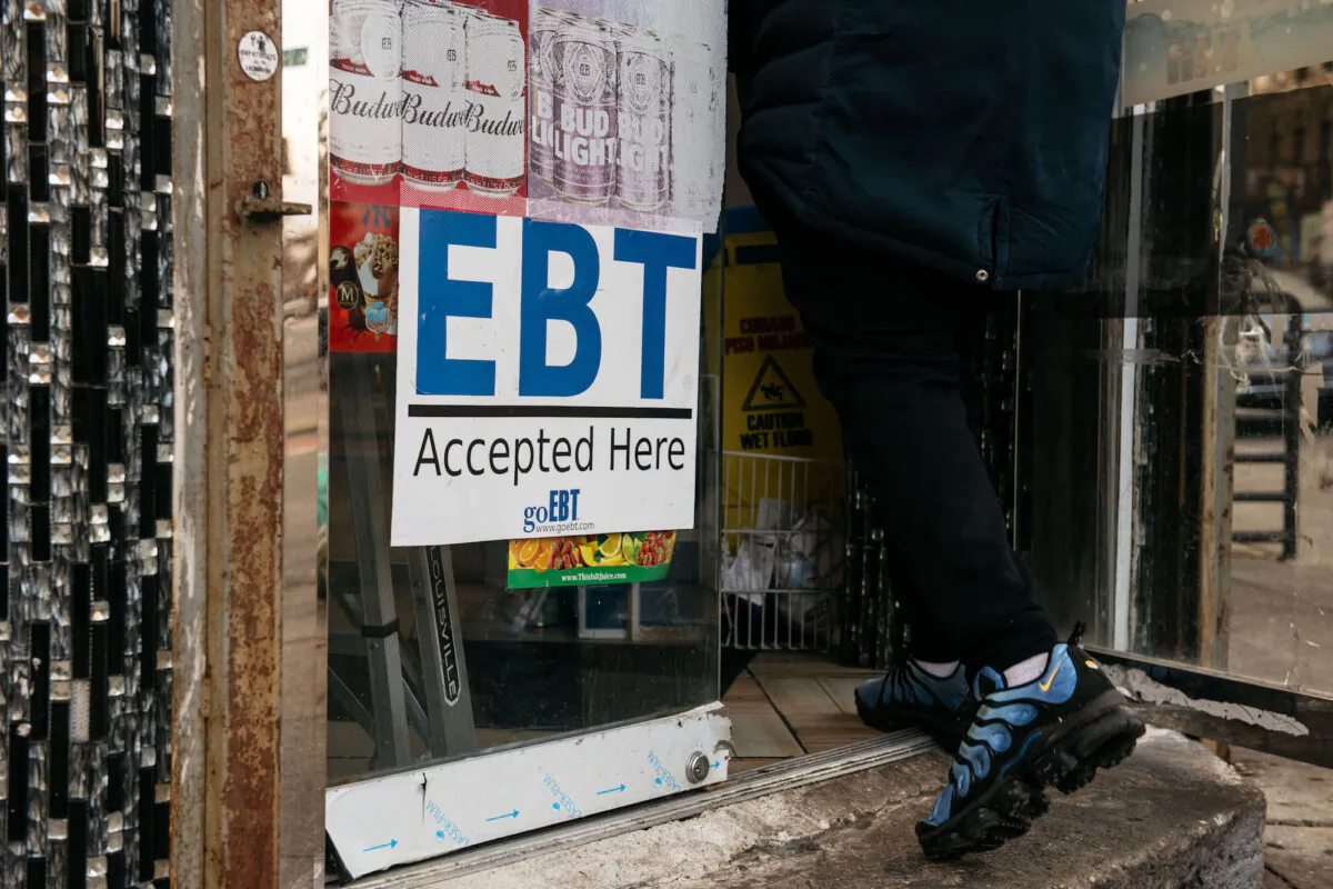 A sign alerting customers about SNAP food stamps benefits is displayed at a Brooklyn grocery store in New York City on Dec. 5, 2019. (Scott Heins/Getty Images)
