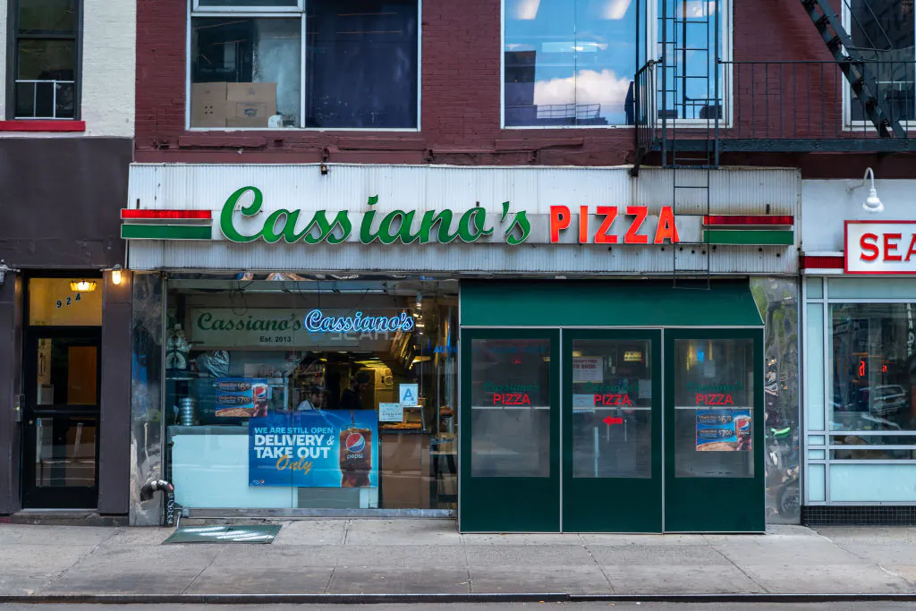 There are all sorts of suggestions for ways to make use of it, such as buying gift cards from local businesses. Above, Cassiana's Pizza in Manhattan has continued to operate during the pandemic. (David Dee Delgado/Getty Images)