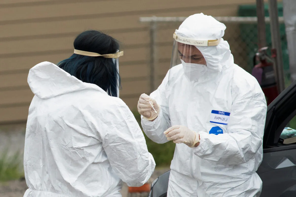 Medical professionals conduct tests for COVID-19 in Bolinas, Calif., on April 20, 2020. (Kate Munsch/Reuters)