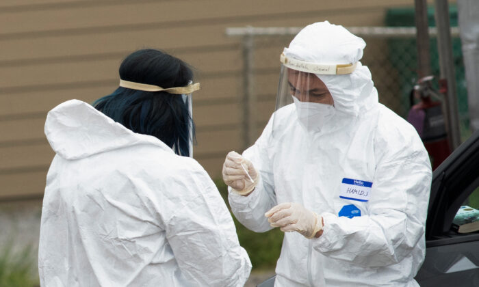 Medical professionals conduct tests for COVID-19 in Bolinas, Calif., on April 20, 2020. (Kate Munsch/Reuters)
