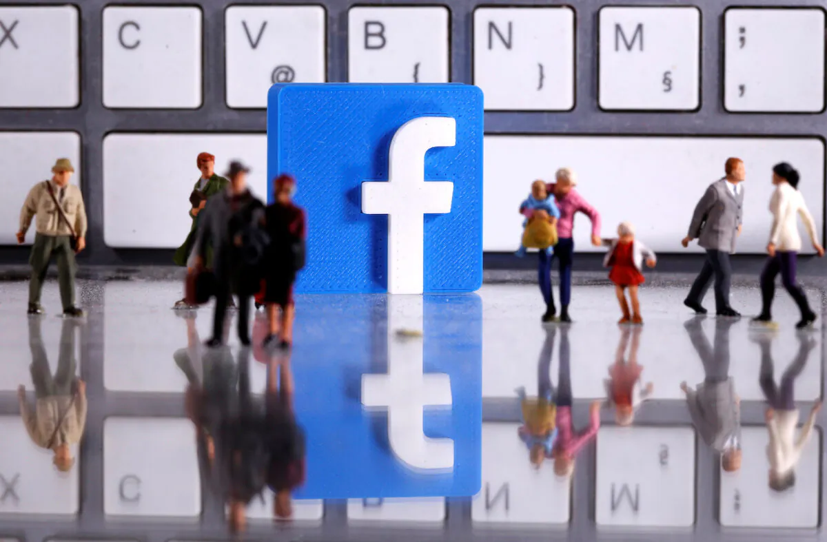 File photo of a 3D printed Facebook logo and toy people figures in front of a keyboard in this illustration taken on April 12, 2020. (Dado Ruvic/Illustration/Reuters)