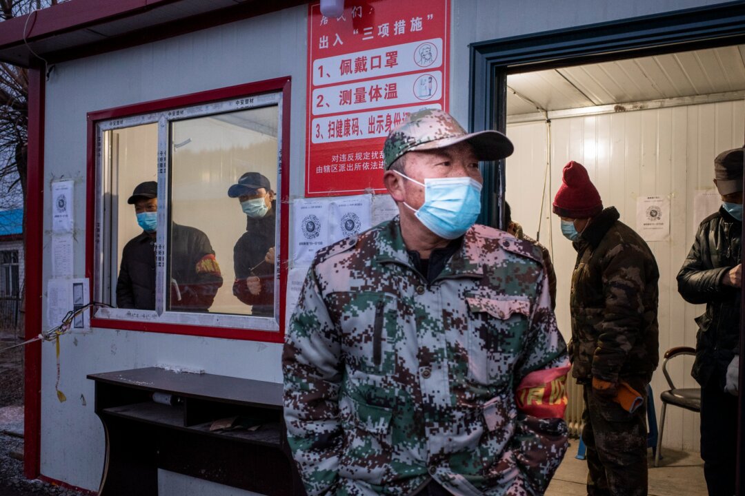 A staff member keeping watch at a checkpoint in the border city of Suifenhe, in China's northeastern Heilongjiang province on April 21, 2020. (STR/AFP via Getty Images)