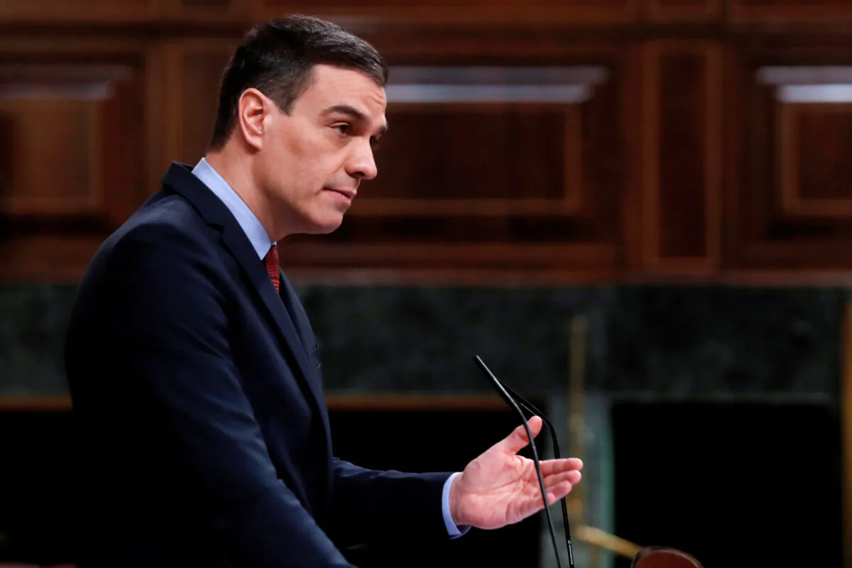 Spanish Prime Minister Pedro Sanchez delivers a speech during a session at the Lower Chamber of the Spanish Parliament in Madrid on April 22, 2020. (J. J. Guillen/Pool/AFP via Getty Images)