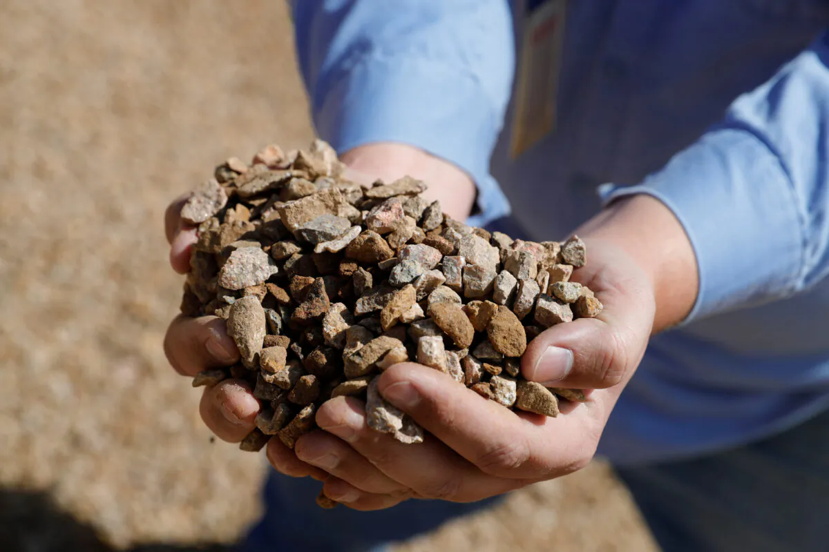 Matt Green, mining/crushing supervisor at MP Materials, displays crushed ore before it is sent to the mill at the MP Materials rare earth mine in Mountain Pass, Calif., on Jan. 30, 2020. (Steve Marcus/Reuters)