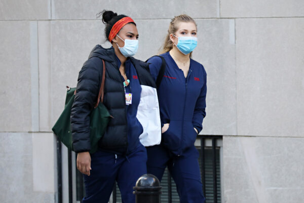 Medical workers arrive for their shift