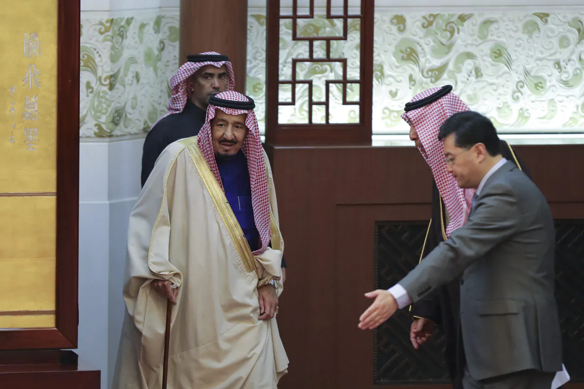 Saudi King Salman bin Abdulaziz (L) arrives to attend a signing ceremony at the Great Hall of the People in Beijing on March 16, 2017. Xi welcomed visiting Saudi King Salman in Beijing as China continues a charm offensive toward the Middle East, a region where it has long kept a low profile. (Lintao Zhang/AFP via Getty Images)