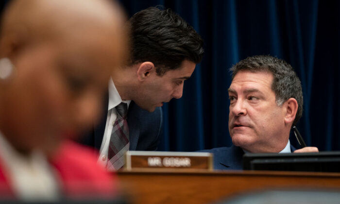 U.S. Rep. Mark Green (R-Tenn.) confers with an aide during a House Oversight and Reform Committee hearing, in the Rayburn House Office Building on Capitol Hill in Washington, on March 11, 2020. (Drew Angerer/Getty Images)