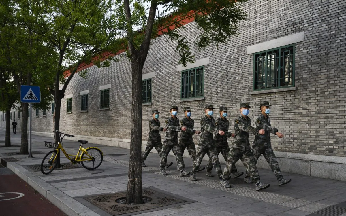 Chinese military march in the street in Beijing on April 22, 2020. (Kevin Frayer/Getty Images)