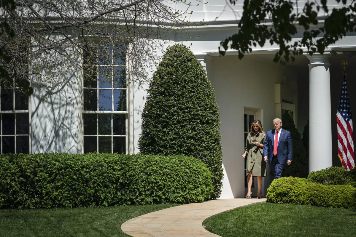 President Donald Trump and First Lady Melania Trump exit the Oval Office as they arrive to participate in a tree planting ceremony in recognition of Earth Day and Arbor Day on the South Lawn of the White House on April 22, 2020. (Drew Angerer/Getty Images)