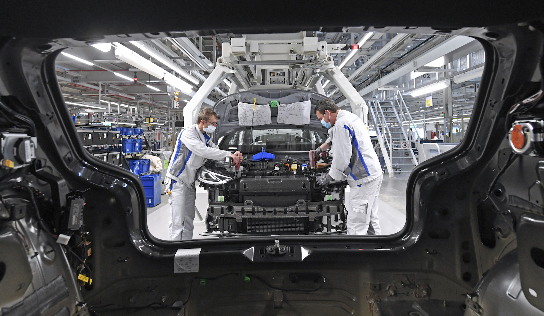 Max Bruehmann (l) and Heiko Gruner employees of German car producer Volkswagen Sachsen,
