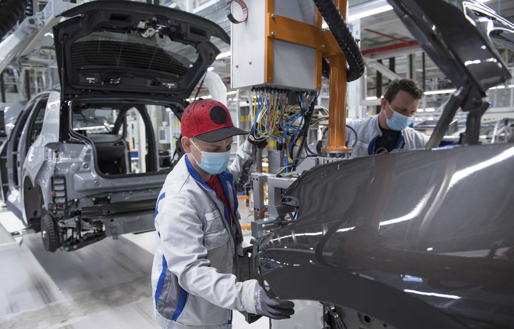 Sebastian Lohse, left, and Heiko Gruner employees of German car producer Volkswagen Sachsen,