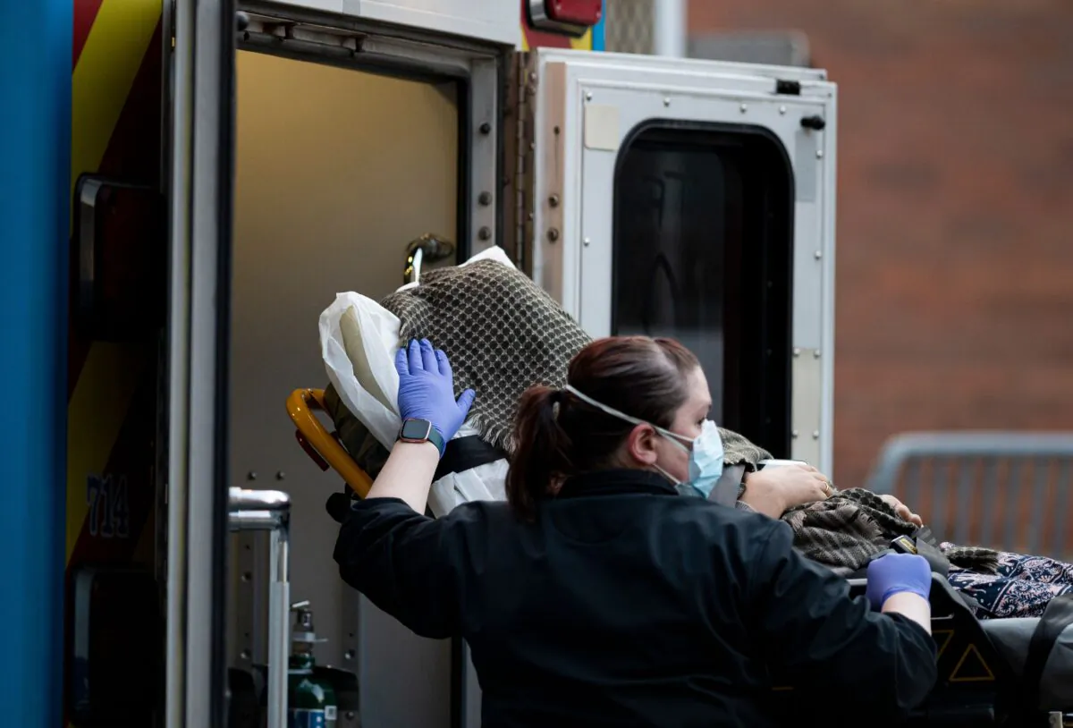A person is transported into the emergency room of the Elmhurst Hospital in Queens, New York City, on April 22, 2020. (Johannes Eisele/AFP via Getty Images)
