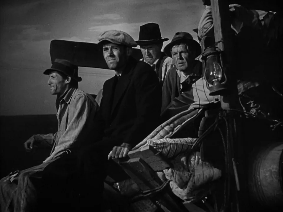 The rural poor heading west in an old jalopy. Henry Fonda (C) stars in “The Grapes of Wrath.” (Twentieth Century Fox)