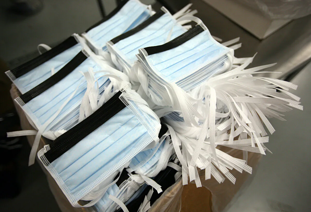 Disposable surgical masks are packed in boxes at Prestige Ameritech in Richland Hills, Texas, on May 3, 2009. (Tom Pennington/Getty Images)