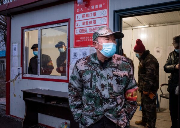 A staff member keeping watch at a checkpoint in the border city