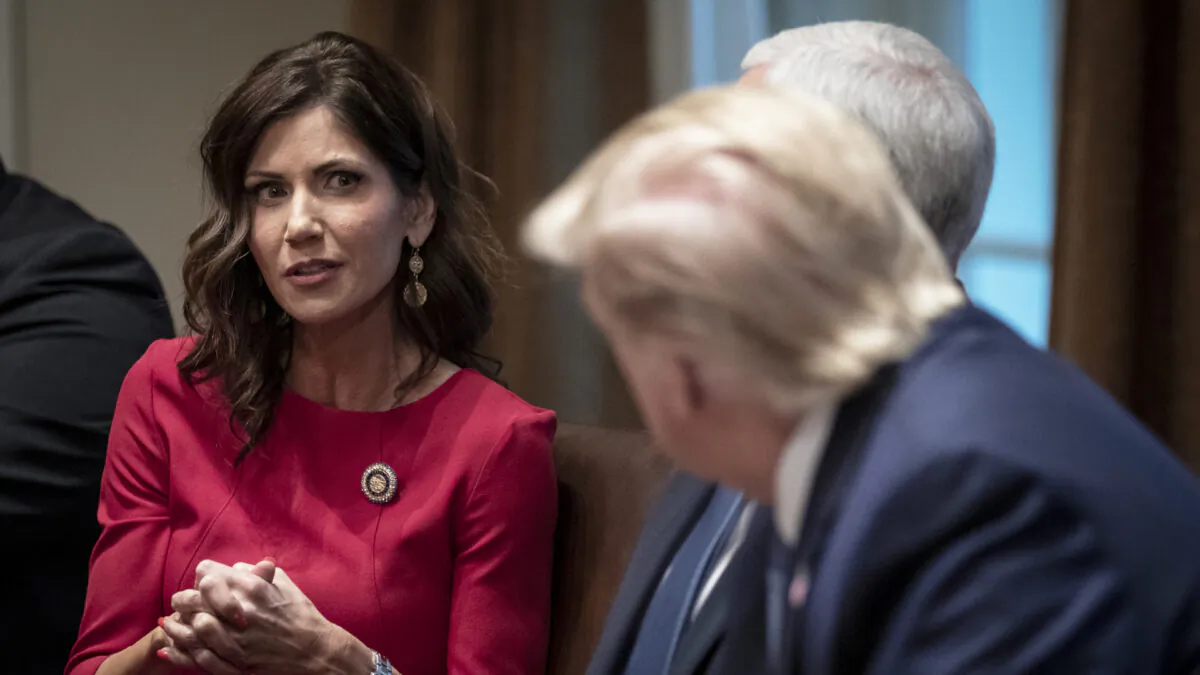 South Dakota Gov. Kristi Noem speaks as President Donald Trump listens during a meeting about the Governors Initiative on Regulatory Innovation in the Cabinet Room of the White House  in Washington on Dec. 16, 2019. (Drew Angerer/Getty Images)