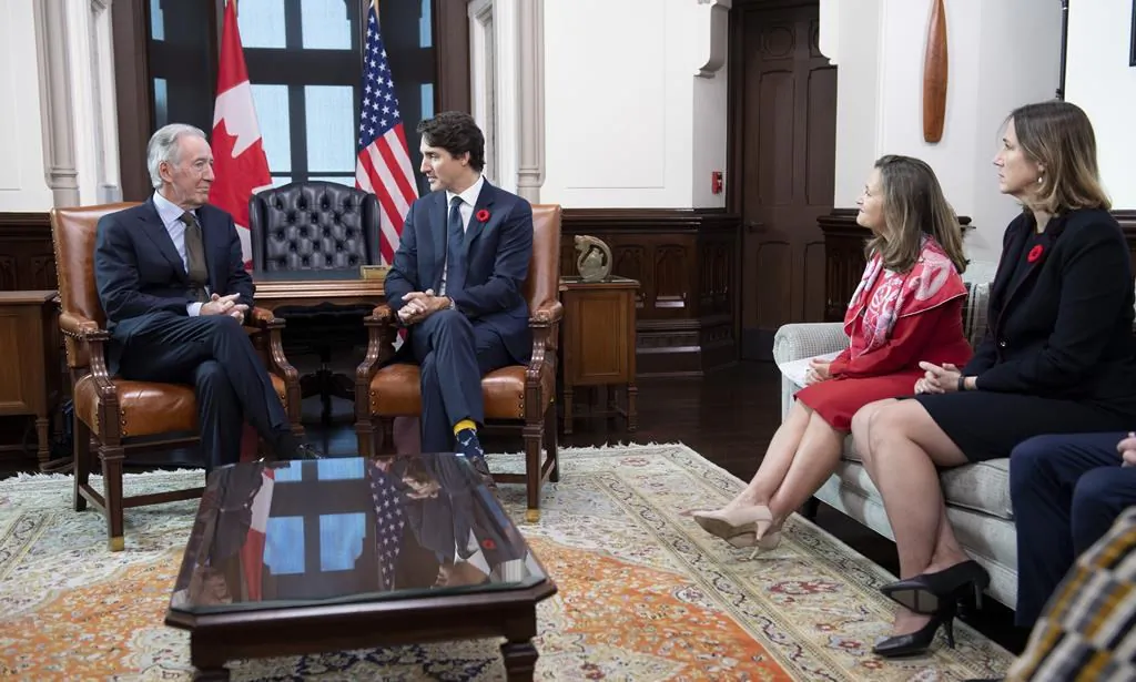 Canada's Minister of Foreign Affairs Chrystia Freeland (second from right), and Acting Ambassador of Canada to the United States of America Kirsten Hillman (right), look on as Prime Minister Justin Trudeau speaks with Richard Neal, Chairman of the Committee on Ways and Means of the United States House of Representatives on Parliament Hill in Ottawa, on Nov. 6, 2019. (The Canadian Press/Adrian Wyld)