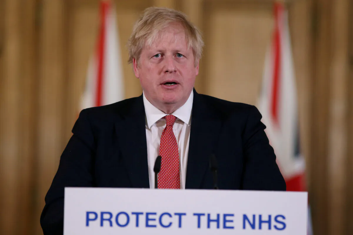 Prime Minister Boris Johnson speaks during a news conference on the ongoing situation with the COVID-19 in London, Britain on March 22, 2020. (Ian Vogler/ Reuters)