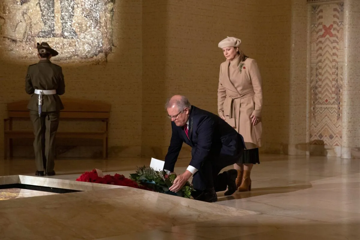 Australian Prime Minister Scott Morrison, accompanied by his wife Jenny, lays a wreath in the Hall of Memory during Anzac Day Commemorative Service at the Australian War Memorial in Canberra on April 25, 2020. (SEAN DAVEY/POOL/Getty Images)
