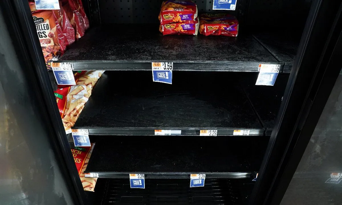 A few bags of frozen french fries are seen on sale in a freezer case at a Giant supermarket in Falls Church, Virginia, U.S., on April 23, 2020.(Kevin Lamarque/Reuters)