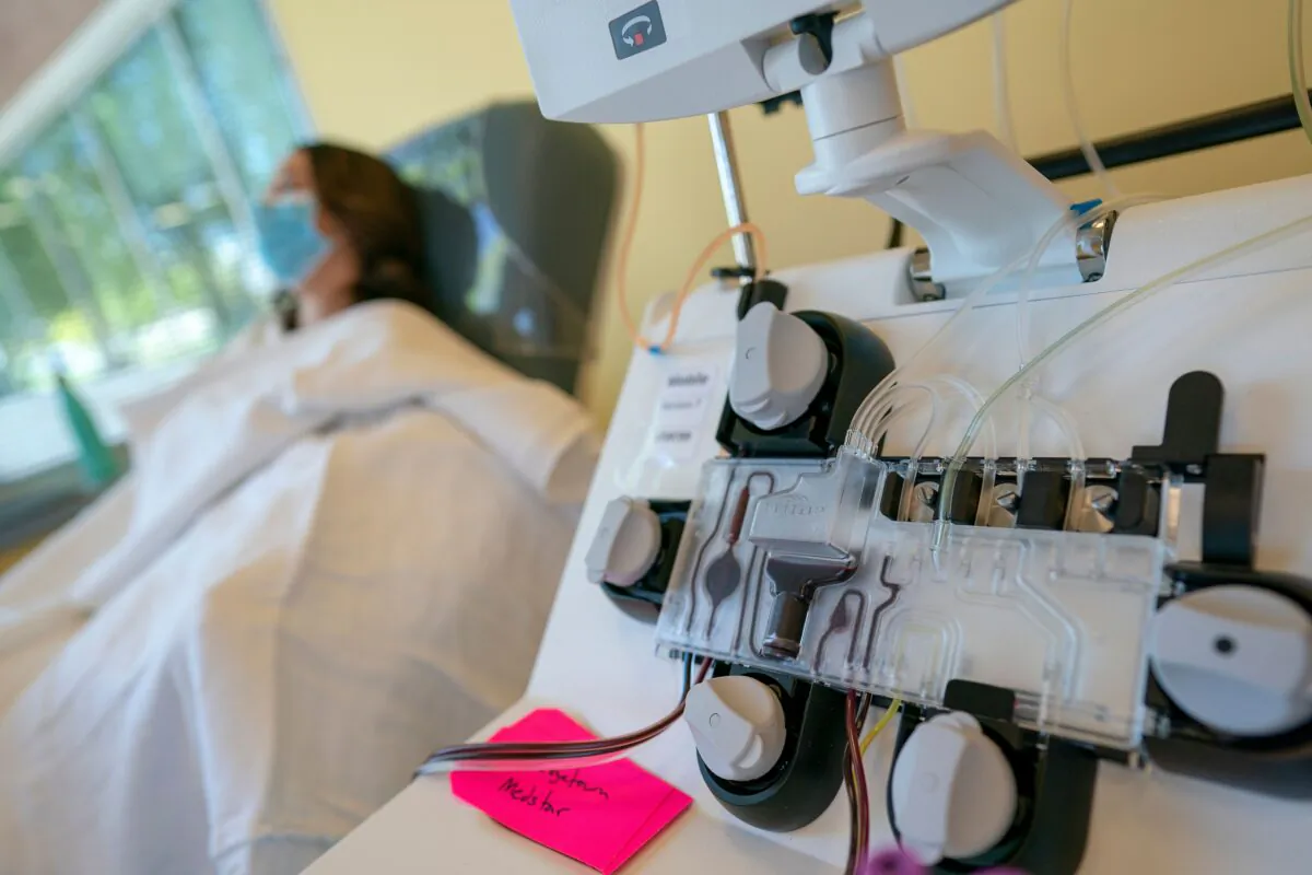 Mckinley Edelman, 26, a recovered COVID-19 patient, donates plasma to MedStar Georgetown University Hospital at Inova Blood Services in Dulles, Virginia on April 22, 2020. (Alex Edelman/AFP/Getty Images)