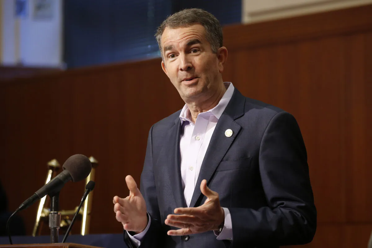 Virginia Gov. Ralph Northam gestures during a news conference at the Capitol in Richmond on April 8, 2020. (Steve Helber/AP Photo)