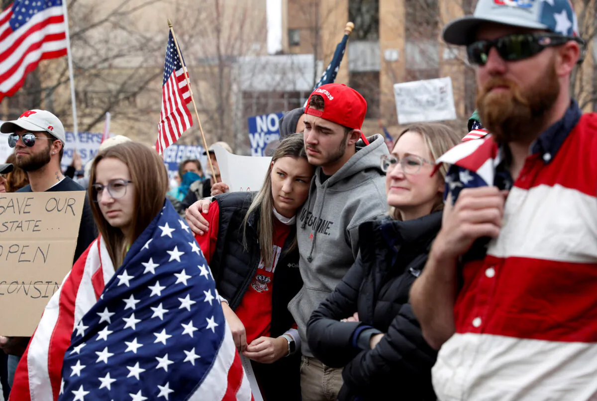 Demonstrators protest the extension of Wisconsin’s stay-at-home order, outside the State Capitol building in Madison, Wisconsin, on April 24, 2020. (Shannon Stapleton/Reuters)