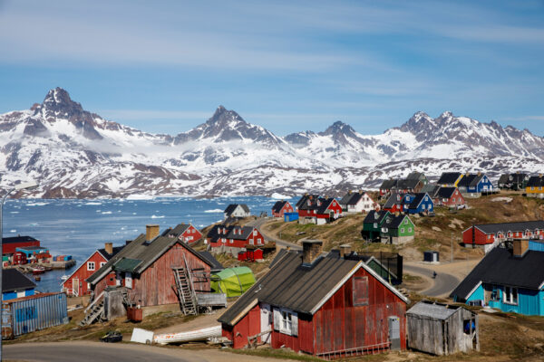 Snow covered mountains rise above the harbor and town of Tasiilaq, Greenland, June 15, 2018. (Lucas Jackson/Reuters)