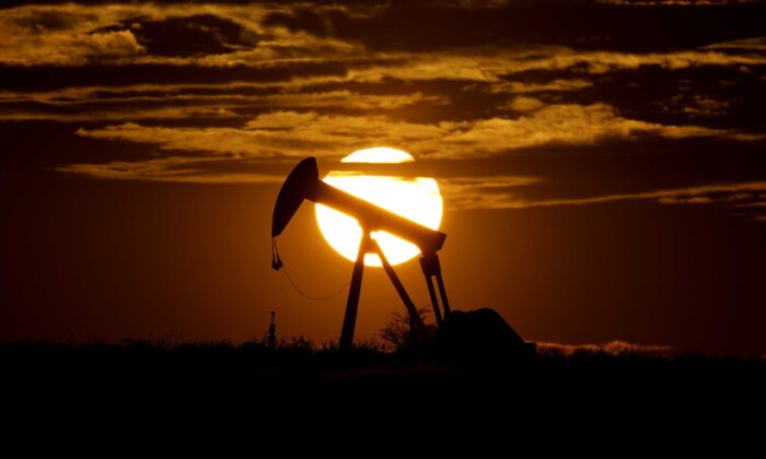 The sun sets behind an idle pump jack near Karnes City, Texas, on April 8, 2020. (Eric Gay/AP Photo)