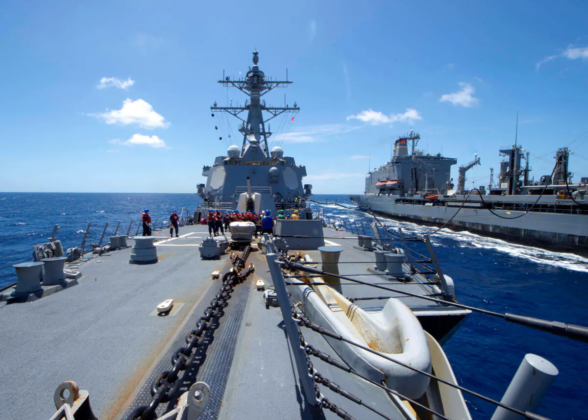 The U.S. Navy Arleigh Burke-class guided-missile destroyer USS Kidd receives fuel from the Military Sealift Command replenishment oiler USNS Guadalupe in the Pacific Ocean March 27, 2020. (Mass Communication Specialist 3rd Class Brandie Nuzzi/U.S. Navy/Reuters)