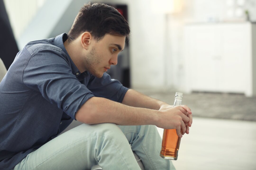 Some people may be more tempted to drink as they face loneliness and boredom at home. (Africa Studio/Shutterstock)