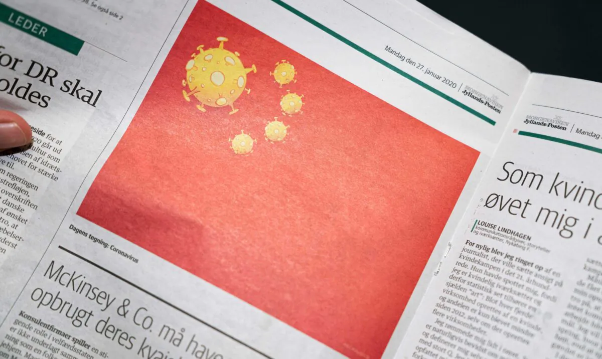 A page of the Danish Daily Newspaper Jyllands-Posten from the Jan. 27, 2020 edition shows a cartoon made by Danish editorial cartoonist Niels Bo Bojesen of the Chinese national flag with a coronavirus, in Copenhagen, on Jan. 28, 2020. (Ida Marie Odgaard/Ritzau Scanpix/AFP via Getty Images)