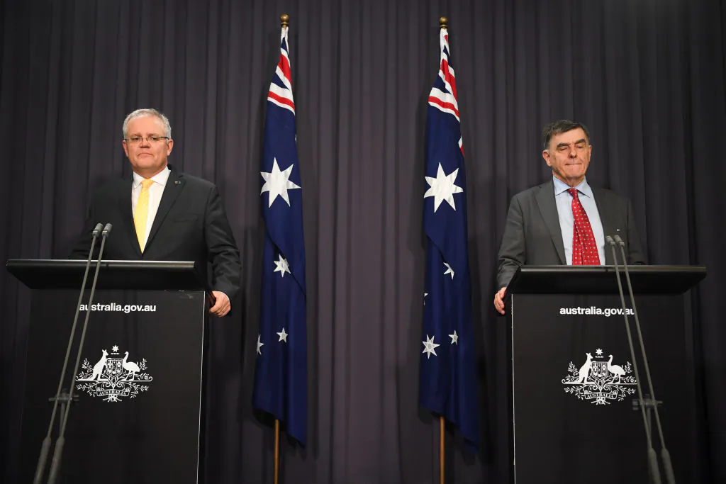 (L-R) Australian Prime Minister Scott Morrison and Australia's Chief Medical Officer Brendan Murphy address the media and the nation on March 24, 2020 in Canberra, Australia. (Lukas Coch - Pool/Getty Images)
