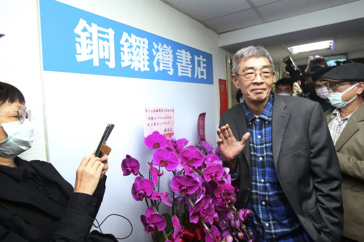 Lam Wing-kee, one of five shareholders and staff at the Causeway Bay Book shop in Hong Kong, waves to the press at his new book shop on the opening day in Taipei, Taiwan, on  April 25, 2020. (Chiang Ying-ying/AP Photo)