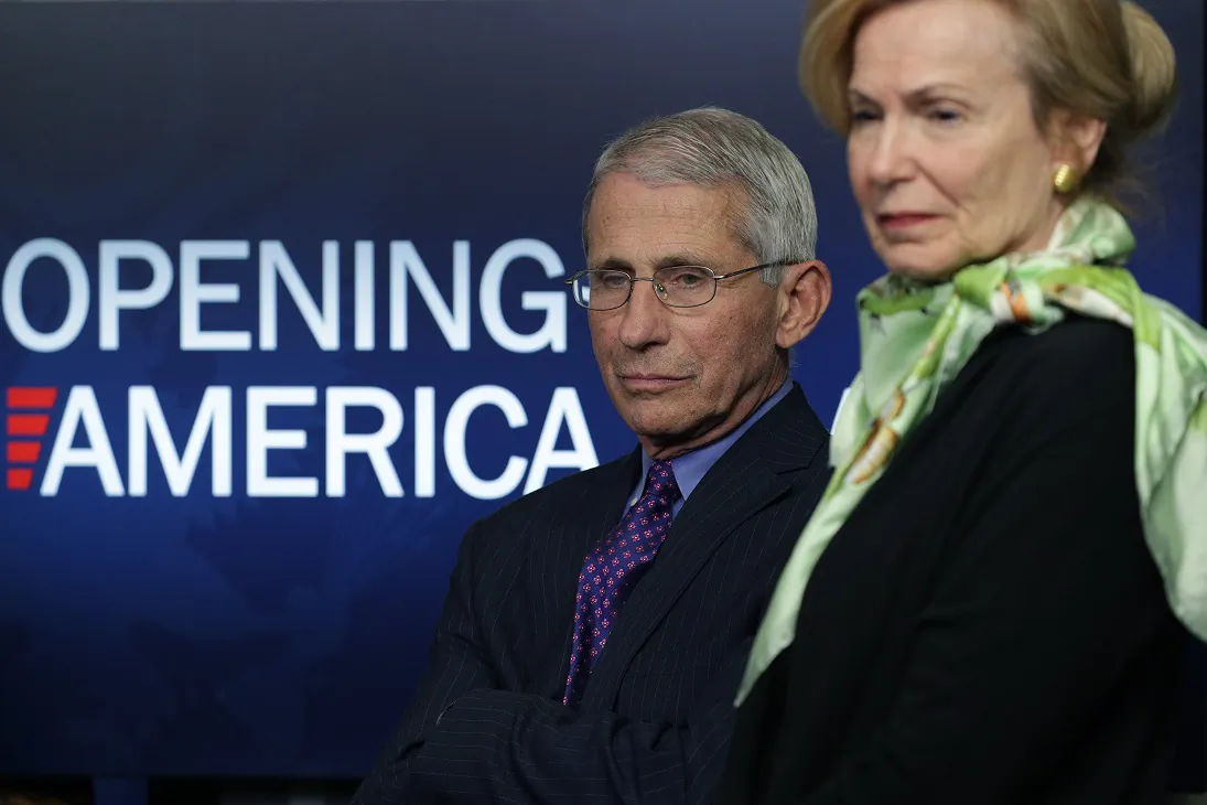 Dr. Anthony Fauci, director of the National Institute of Allergy and Infectious Diseases, and Deborah Brix, White House coronavirus response coordinator, listen to President Donald Trump speak at the daily briefing of the White House Coronavirus Task Force at the White House in Washington on April 16, 2020. (Alex Wong/Getty Images)