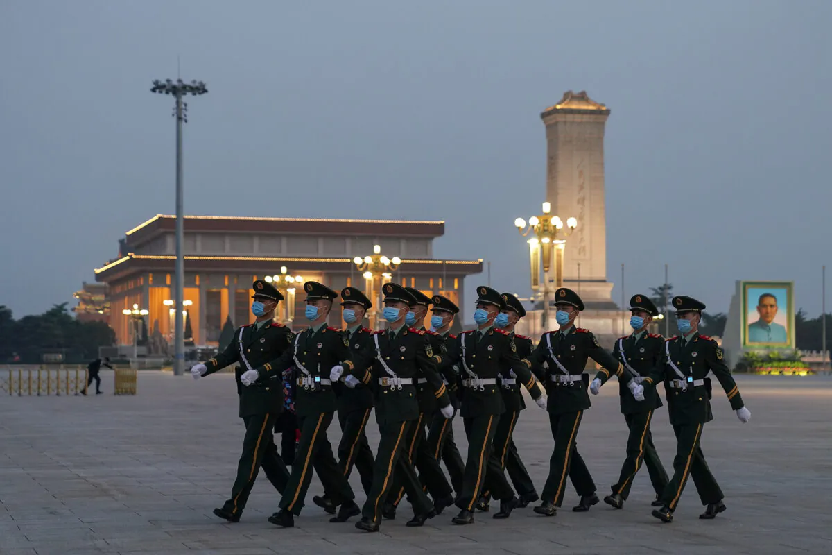 Chinese military soldiers march at Tiananmen Square in Beijing on April 28, 2020. (Lintao Zhang/Getty Images)