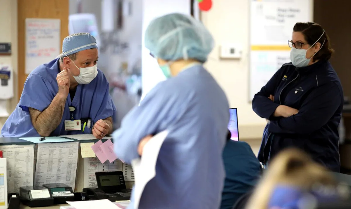 Doctors and nurses confer in the Intensive Care Unit of MedStar St. Mary's Hospital in Leonardtown, Maryland, April 8, 2020. (Win McNamee/Getty Images)