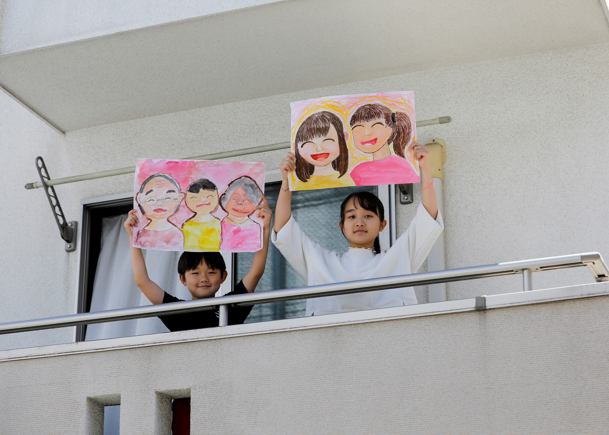 japanese children holding signs
