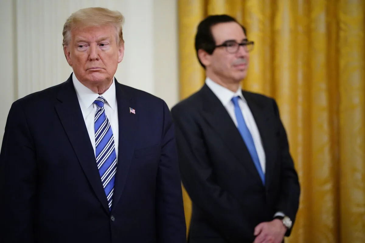 President Donald Trump, left, and Treasury Secretary Steven Mnuchin, listen to Senior Advisor to the President Ivanka Trump as she speaks in the East Room of the White House in Washington on April 28, 2020. (Mandel Ngan/AFP via Getty Images)