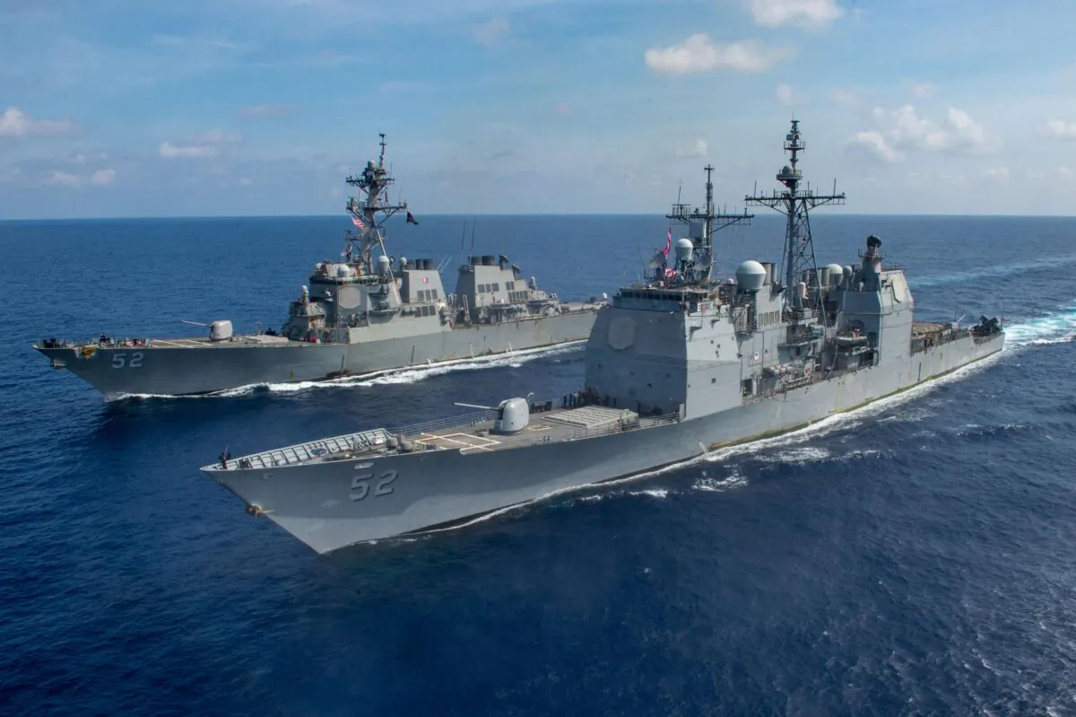 The guided missile cruiser USS Bunker Hill (CG 52), front, and the Arleigh Burke-class guided-missile destroyer USS Barry (DDG 52) transit the South China Sea. (Mass Communication Specialist 3rd Class Nicholas V. Huynh/U.S. Navy photo/Released)