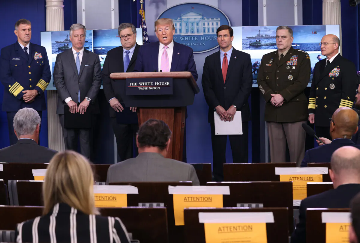President Donald Trump speaks at the press briefing room flanked by Attorney General William Barr (3rd L), Defense Secretary Mark Esper (3rd R), Chairman of the Joint Chiefs of Staff Gen. Mark Milley (2nd R), National Security Advisor Robert O'Brien (2nd L) and Chief of Naval Operations Admiral Michael Gilday (R) April 1, 2020, in Washington. (Win McNamee/Getty Images)