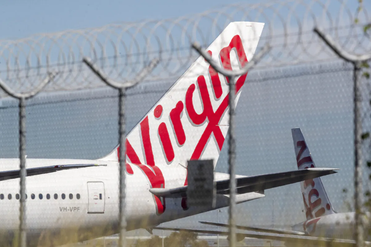 Grounded Virgin planes are seen parked on a tarmac at Brisbane Airport in Brisbane, Australia, on April 21, 2020. (Jono Searle/Getty Images)