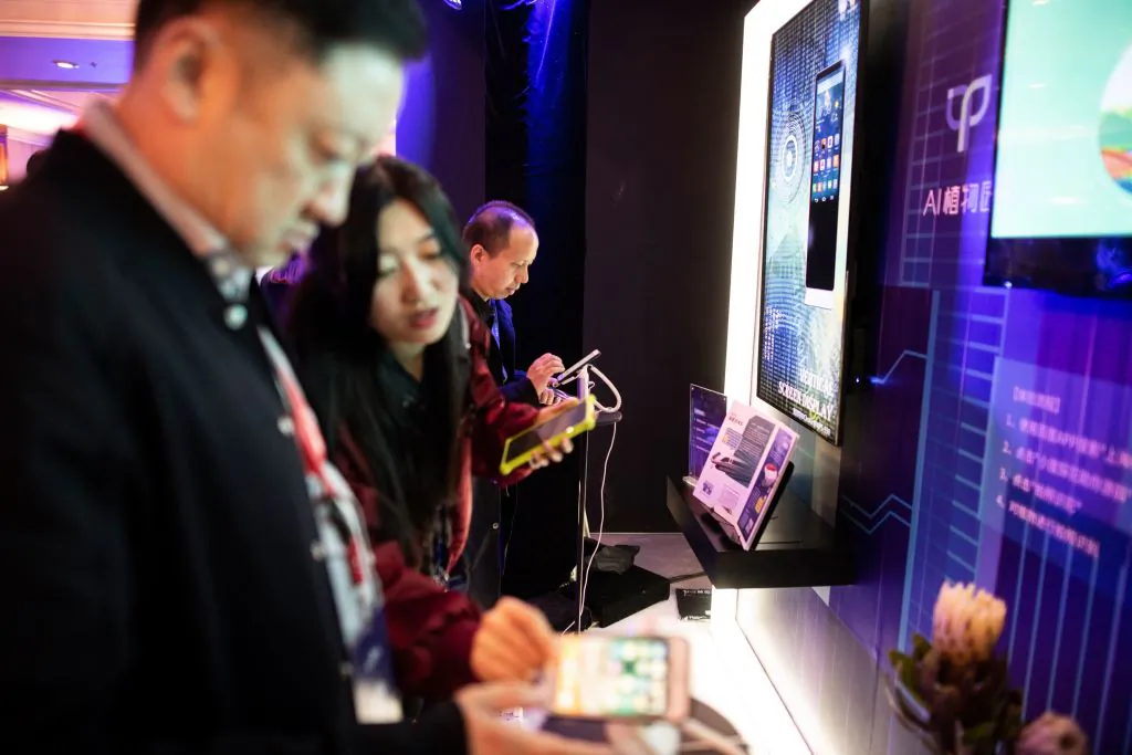 Guests look at Baidu's products at the annual Baidu World Technology Conference in Beijing on Nov. 1, 2018. (Fred Dufour/AFP via Getty Images)