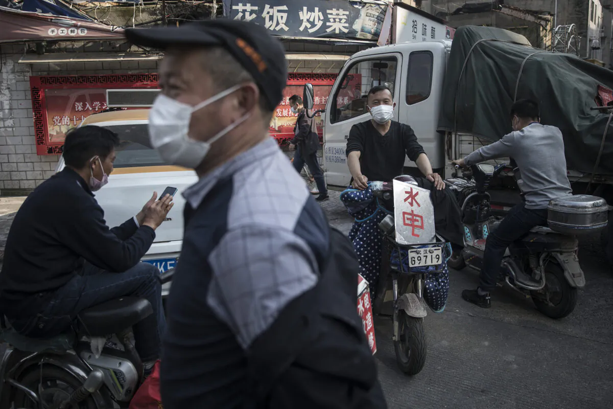 The migrant workers are waiting for work in the street in Wuhan, China on April 9, 2020. (Getty Images)