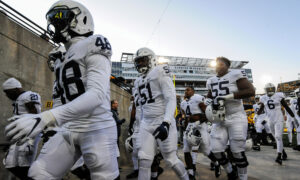 US College Towns on Edge as CCP Virus Threatens Football Season