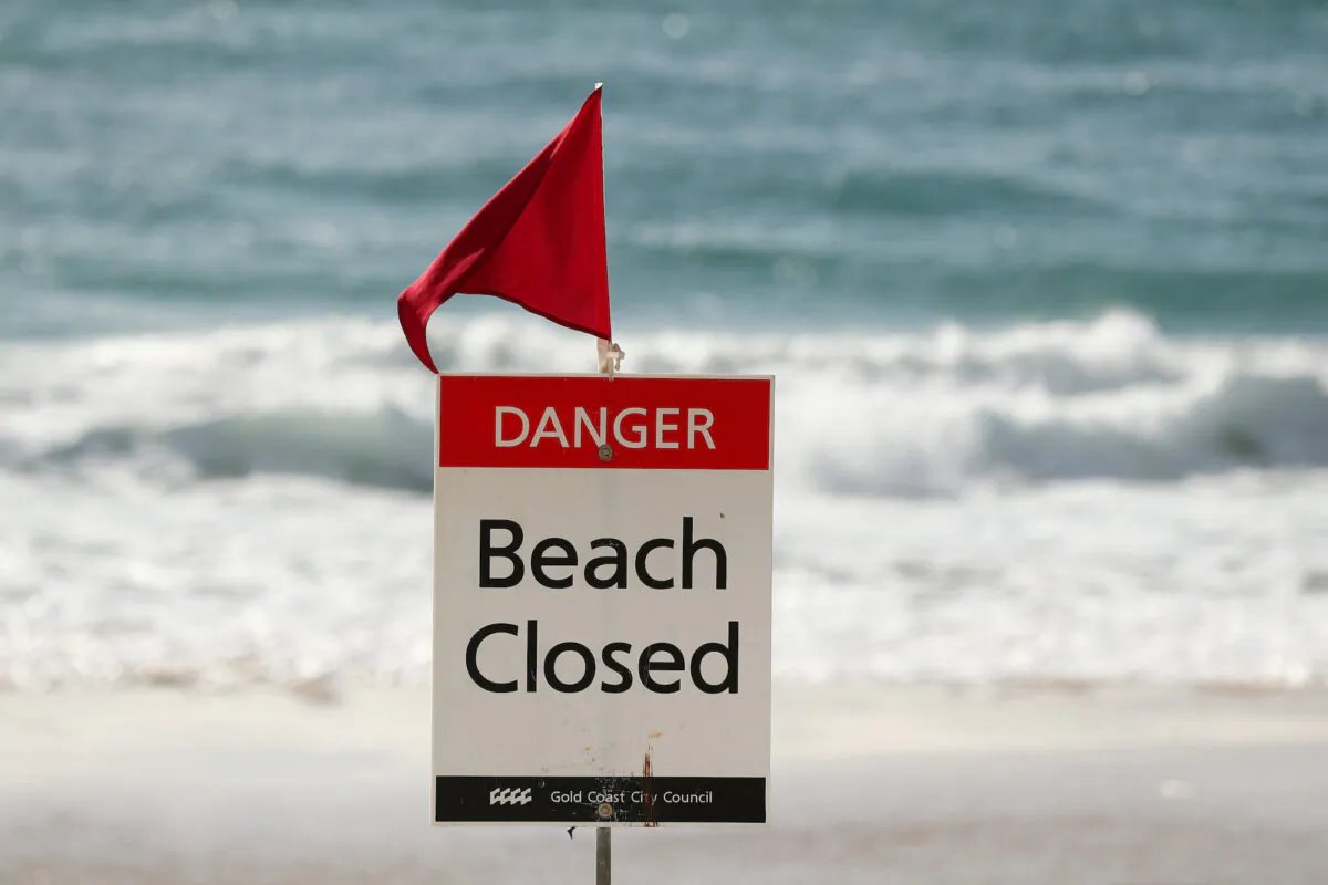 Beach Closed sign at Surfers Paradise beach on April 8, 2020 in Gold Coast, Australia. (Chris Hyde/Getty Images)