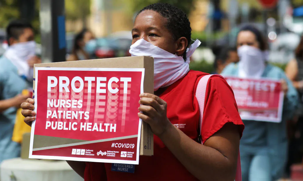 Nurses and supporters protest the lack of personal protective gear available at UCI Medical Center amid the CCP virus pandemic in Orange, Calif., on April 3, 2020. (Mario Tama/Getty Images)