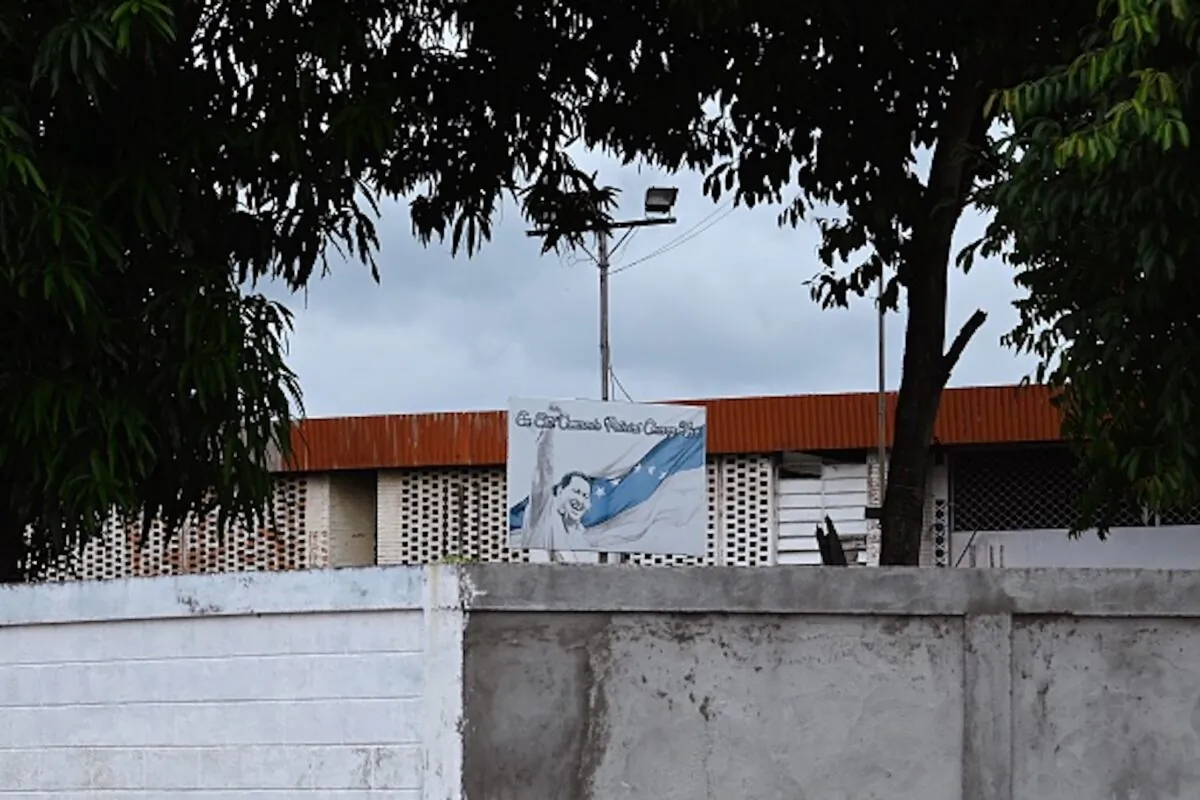 A billboard depicting late Venezuelan President Hugo Chavez is seen on May 25, 2019 on the roof of the police station jail where prisoners were killed during clashes on the eve, in the town of Acarigua, in the Venezuelan state of Portugues. (Marvin Recinos/AFP/Getty Images)