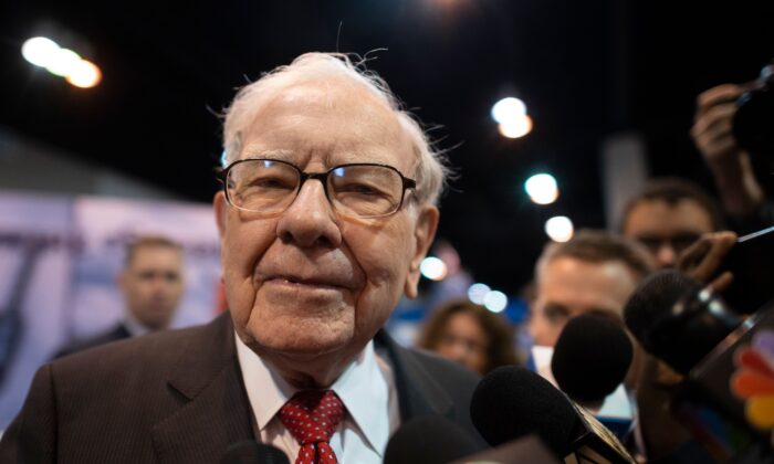 Warren Buffett (C), CEO of Berkshire Hathaway, speaks to the press as he arrives at the 2019 annual shareholders meeting in Omaha, Neb., on May 4, 2019. (Johannes Eisele/AFP via Getty Images)